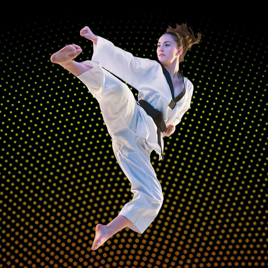 Martial Arts Lessons for Adults in Pickering ON - Girl Black Belt Jumping High Kick