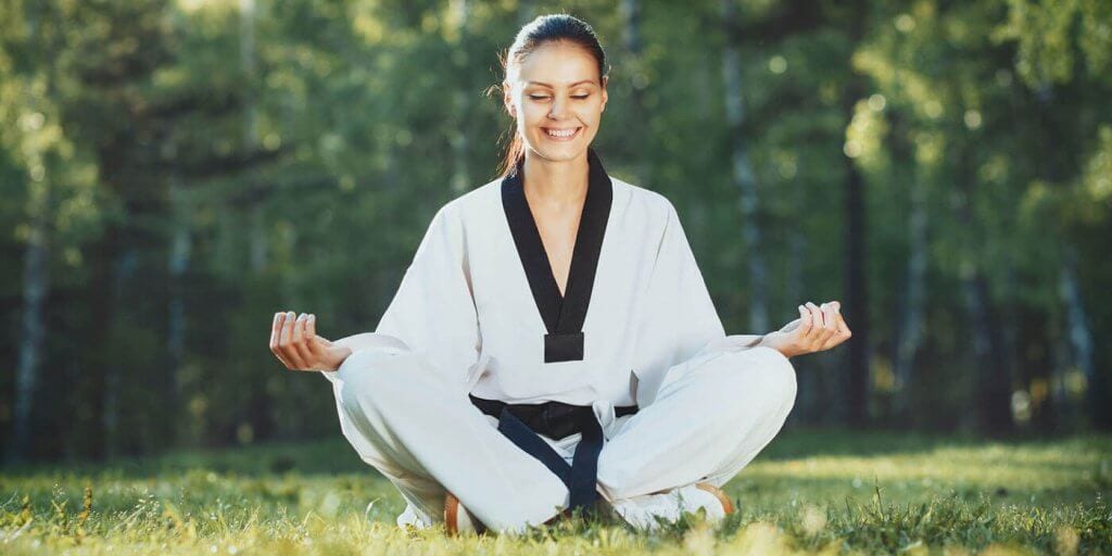 Martial Arts Lessons for Adults in Pickering ON - Happy Woman Meditated Sitting Background